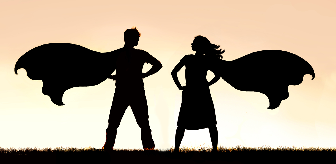 nojs A silhouette of 2 people dressed as superheros