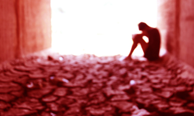 Man sitting in a tunnel