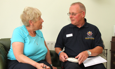 Woman and firefighter talking
