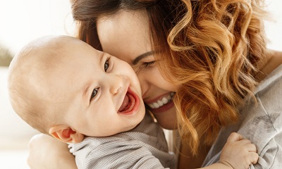Laughing baby and mum