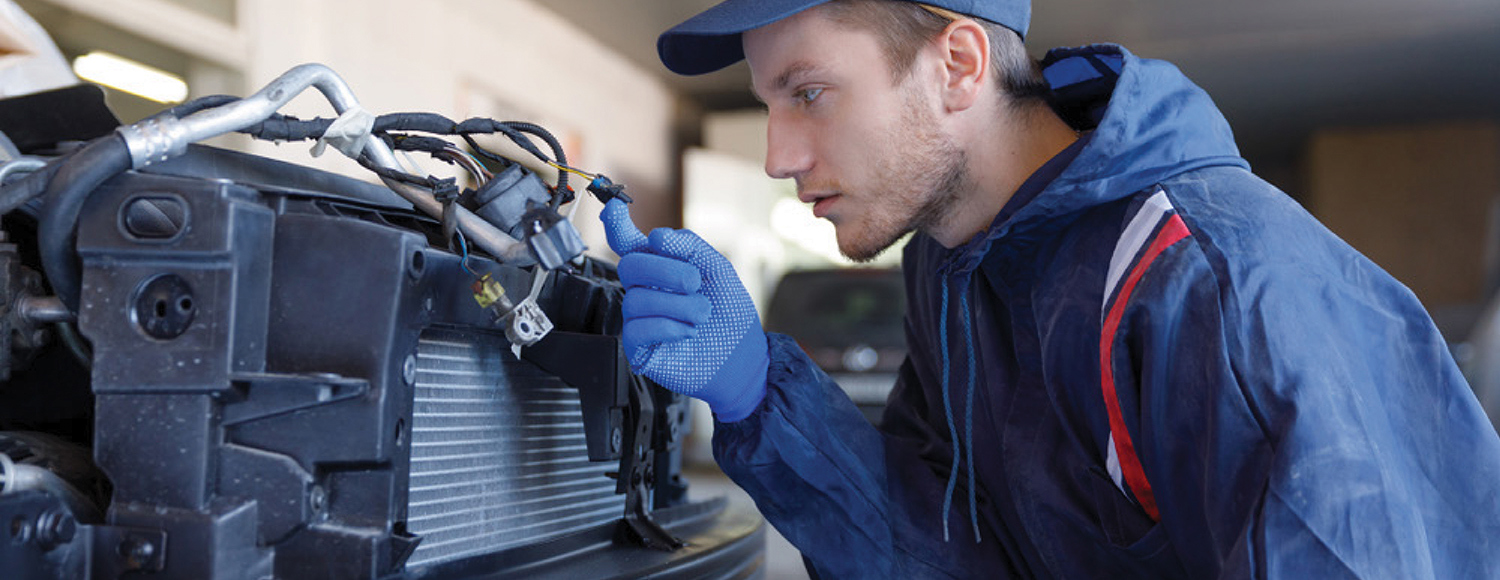 Mechanic inspecting a car
