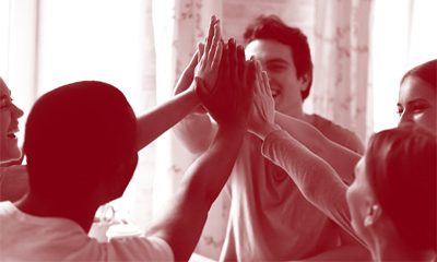 Young people giving a high five