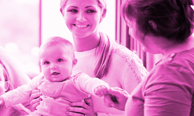 A family chatting with a woman