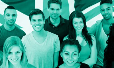 Group of young people in front of a UK flag