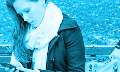 A young woman checking her mobile phone