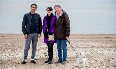 People posing for a photo on the beach