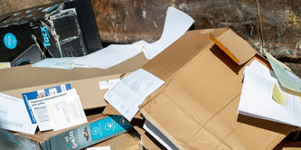 Cardboard and paper in a container at a recycling centre.