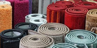 Several rolled up carpets.
