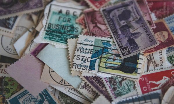 Lots of different postage stamps overlapping each other.