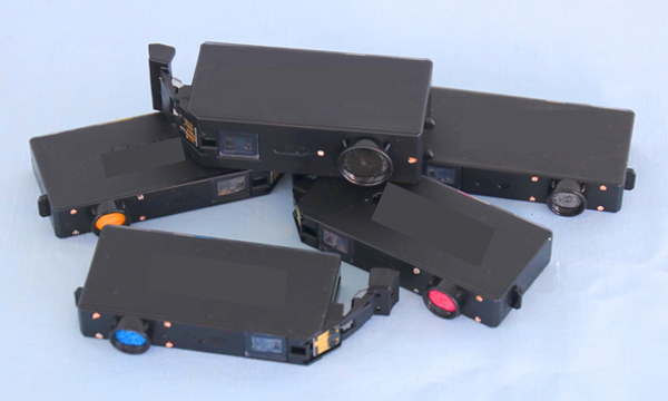 A pile of 5 old ink cartridges.