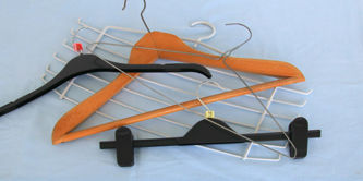 Plastic, wooden and metal coat hangers.