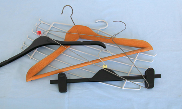Plastic, wooden and metal coat hangers.