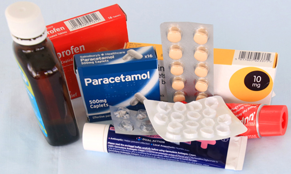 Various types of medicine packaging, including tubes, a bottle and blister packs.
