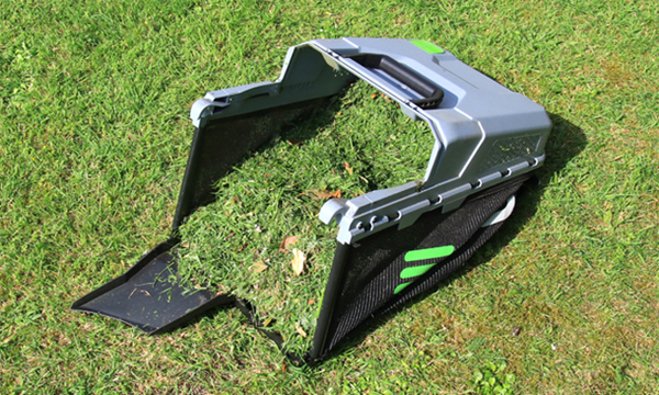A lawn mower grass collector filled with cuttings.