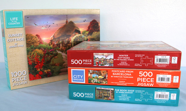 4 jigsaw puzzles in boxes,