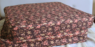 A brown mattress with flower pattern.