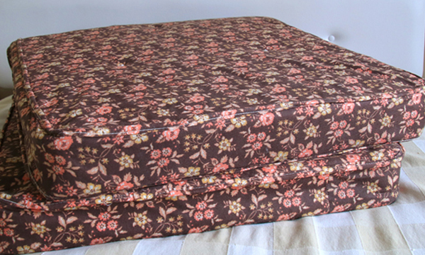 A brown mattress with flower pattern.