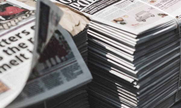 2 stacks of newspapers.