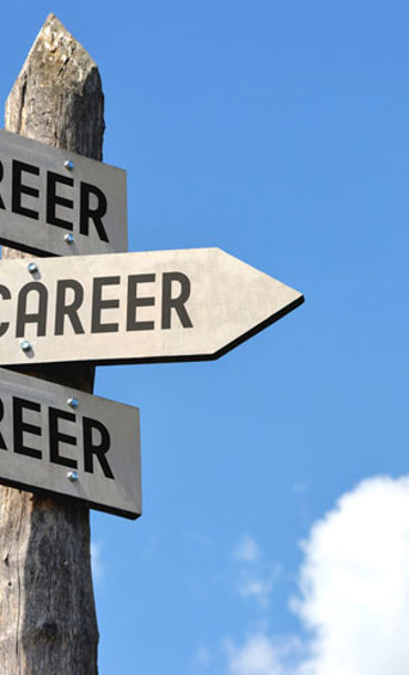 A signpost with signs saying career pointing in all directions