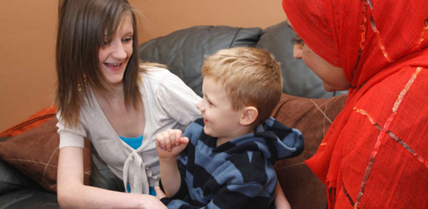 nojs Two ladies sat with smiling child