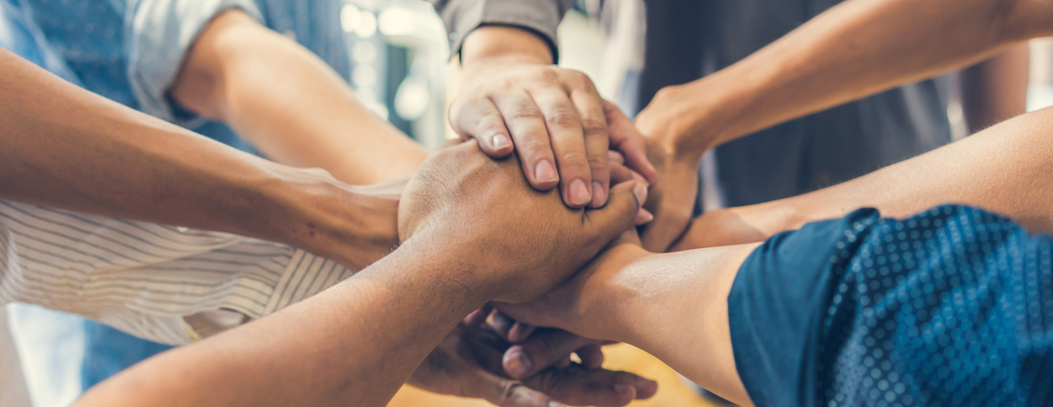 Group of people holding hands