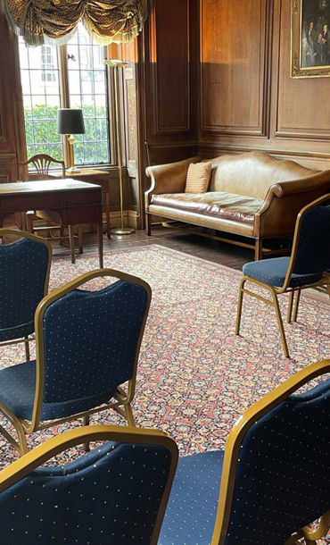 Chairs laid out in the Warnham room facing front windows