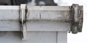 A dirty gutter pipe