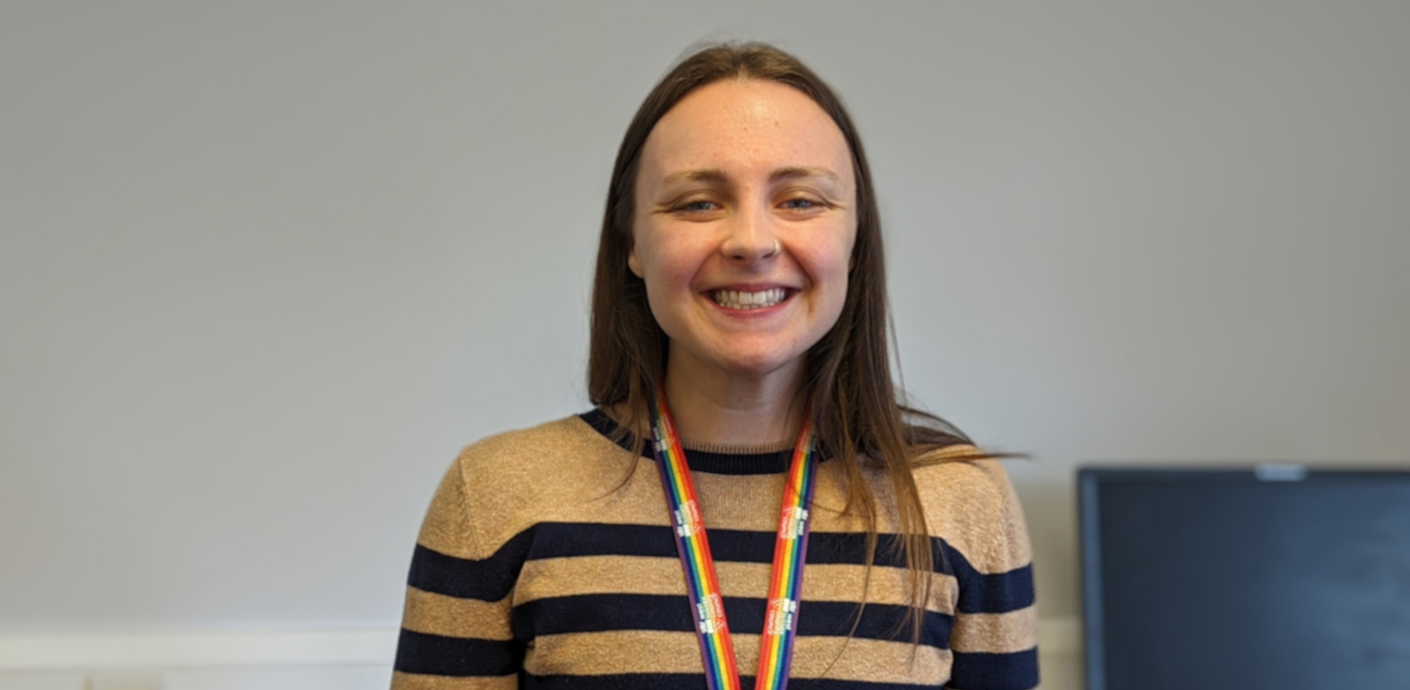 nojs haley, wearing a striped jumper, necklace and a big smile