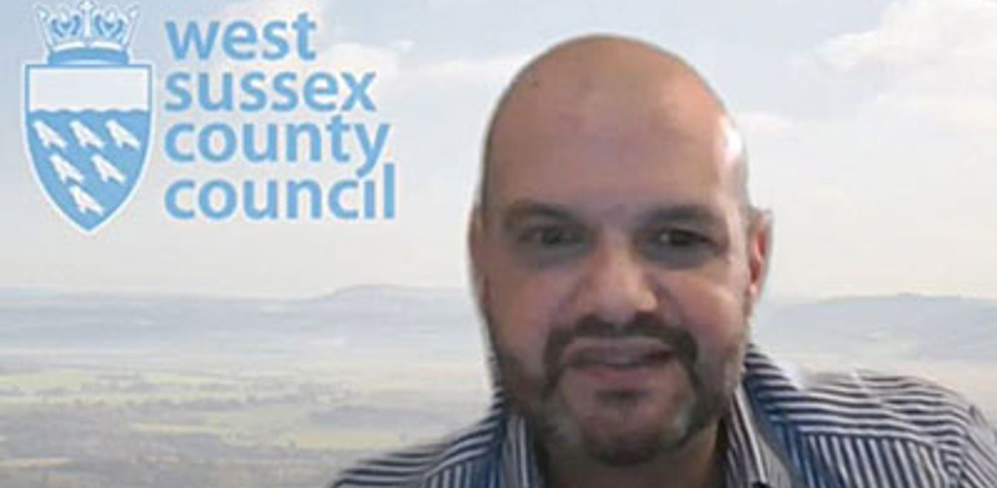 nojs Andrew in front of a council backdrop