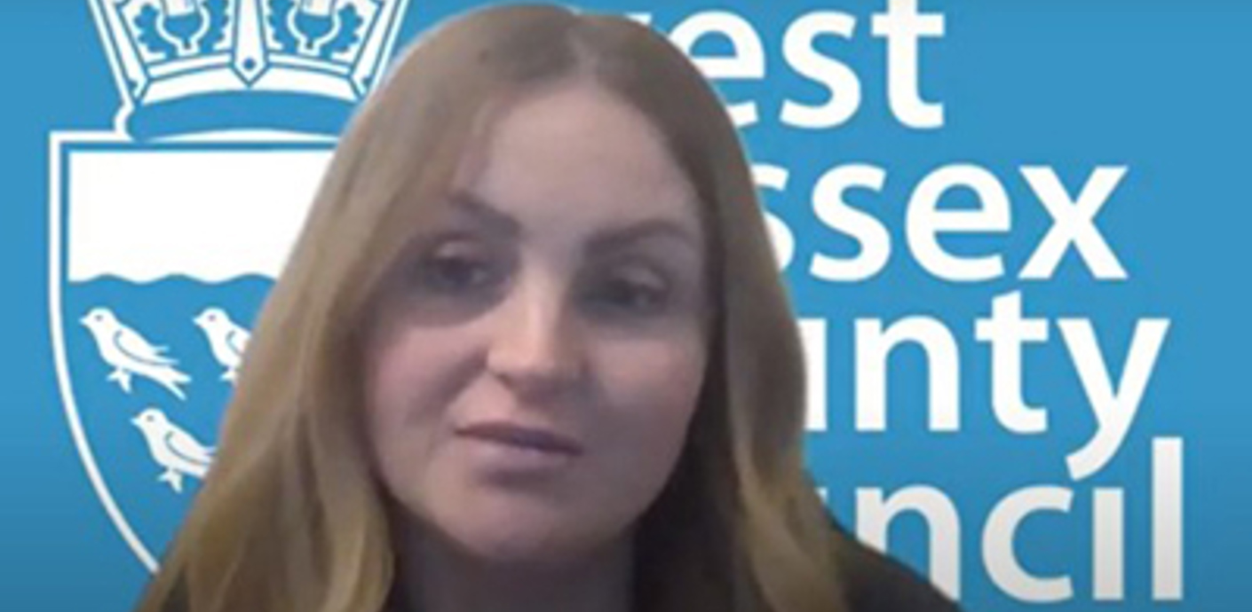 nojs Rachel in front of a council backdrop