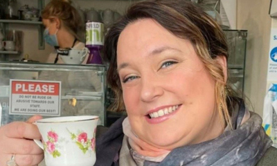 Rachel, smiling with a cuppa