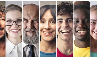 Seven smiling people's faces