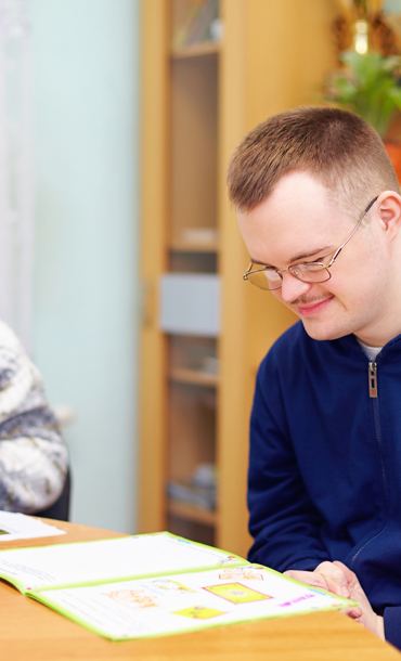 Adults with learning difficulties performing activities.