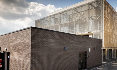 The breathing apparatus building in the foreground and the live fire training building behind