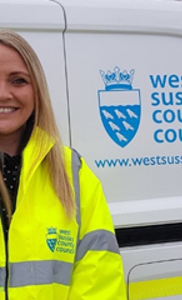 Woman standing in front of a van