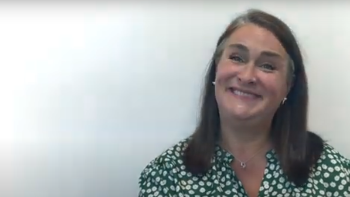 A member of our team smiling whilst being interviewed