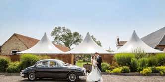 Couple and a car at Southend Barns