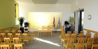 The Henshall ceremony room with chairs laid out facing the front table