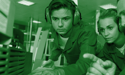 Young people wearing ear defenders