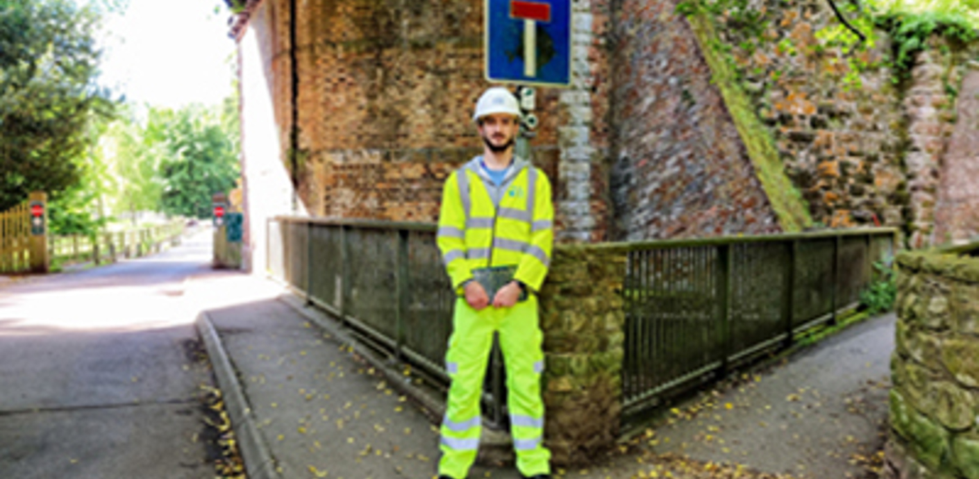 nojs Man standing in front of a bridge
