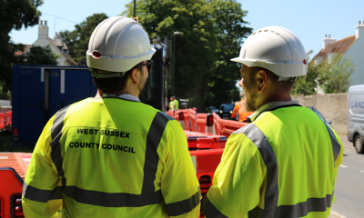 Two workmen wearing hard hats