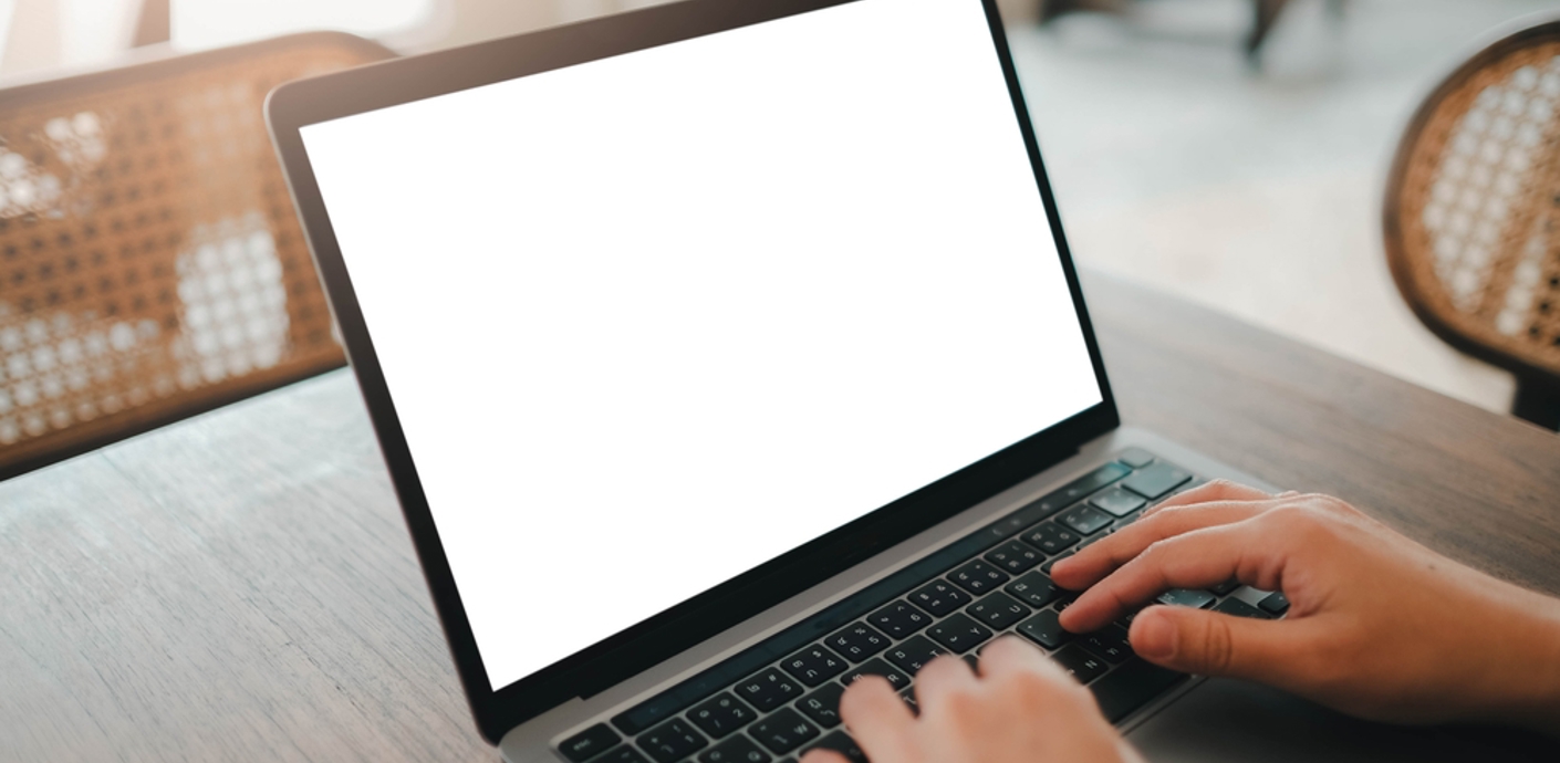 nojs Person typing at a laptop screen