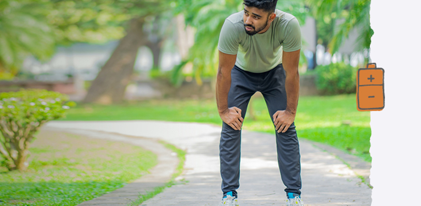 nojs A young man taking a breather while exercising in a park.