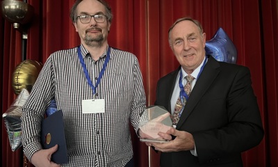 Darren Clarke who was awarded Learner of the Year stands next to the Cabinet Member for Economy and Skills