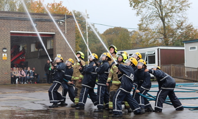 IGNITE students carry out a hose drill
