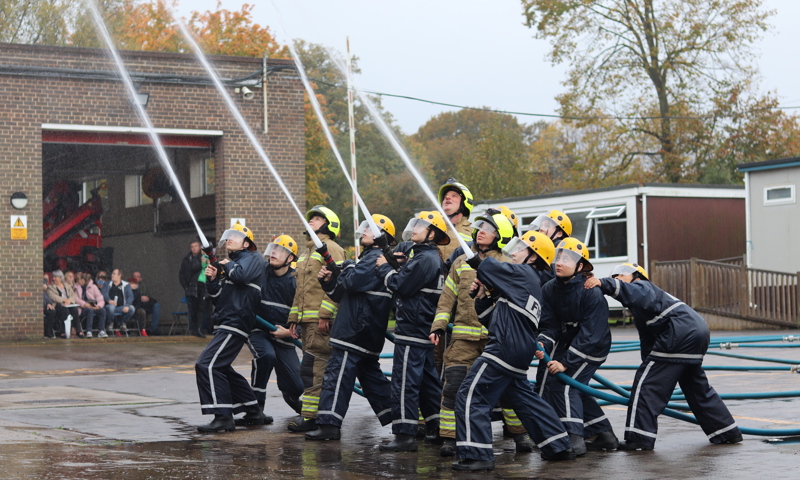IGNITE students carry out a hose drill
