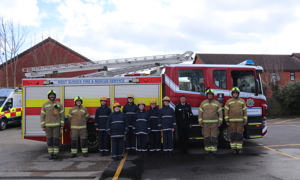 GRIT students standing in front of a fire engine with the Targeted Education Team and the Area Manager for Service Delivery